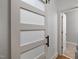 Modern barn door leading to the bathroom features frosted glass panels at 2007 Watson Rd, Durham, NC 27704