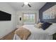 Bright bedroom with hardwood floors, and a dark accent wall for a contemporary feel at 2007 Watson Rd, Durham, NC 27704