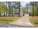 Charming gray home with a white porch and a detached two-car garage at 2007 Watson Rd, Durham, NC 27704