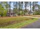 Lovely home with a charming porch and a long driveway leading to a detached garage at 2007 Watson Rd, Durham, NC 27704
