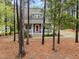 Two-story home with a cozy front porch and natural landscaping at 2007 Watson Rd, Durham, NC 27704