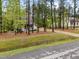 Home with mature trees, a long driveway, and a cozy front porch at 2007 Watson Rd, Durham, NC 27704