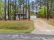 Beautiful home with a long driveway and a charming front porch at 2007 Watson Rd, Durham, NC 27704