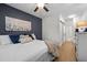 Main bedroom features modern decor, and a barn door leading to the bathroom and closet at 2007 Watson Rd, Durham, NC 27704