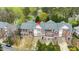 A beautiful aerial view of a multi-unit complex with brick facades and manicured landscaping at 214 Lions Gate Dr, Cary, NC 27518