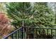 Private balcony offers serene wooded views, ideal for relaxation and enjoying the natural surroundings at 214 Lions Gate Dr, Cary, NC 27518
