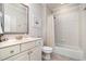 Bathroom features bright light, tiled shower, and vanity at 214 Lions Gate Dr, Cary, NC 27518