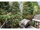 Outdoor deck with grill, perfect for entertaining with a backdrop of lush greenery and mature trees at 214 Lions Gate Dr, Cary, NC 27518