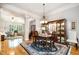 Open dining area flows seamlessly into living spaces, featuring hardwood floors and abundant natural light at 214 Lions Gate Dr, Cary, NC 27518