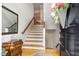 Inviting foyer with hardwood floors, staircase, and decorative accents at 214 Lions Gate Dr, Cary, NC 27518