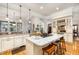 Gourmet kitchen features a large island, granite countertops, and stainless steel appliances at 214 Lions Gate Dr, Cary, NC 27518
