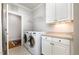 Laundry room with full washer dryer, and cabinet storage at 214 Lions Gate Dr, Cary, NC 27518