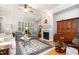 Bright living room with plantation shutters and hardwood flooring at 214 Lions Gate Dr, Cary, NC 27518