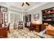 Well-appointed office with hardwood floors, plantation shutters, and built-in bookshelves at 214 Lions Gate Dr, Cary, NC 27518