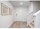 Bright entryway featuring wood-look flooring, and neutral decor leading into the main living areas at 2144 Monk Dr, Haw River, NC 27258