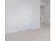 Carpeted hallway leads to a closet and bedroom for an uncluttered living space at 2144 Monk Dr, Haw River, NC 27258