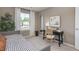 Cozy bedroom featuring a twin bed, desk, and neutral color scheme creating a peaceful and inviting space at 2145 Monk Dr, Haw River, NC 27258