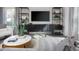 Bright living room featuring stylish decor, an entertainment center, and modern furniture at 2145 Monk Dr, Haw River, NC 27258