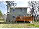 Backyard view with a wooden deck and a lawn area, perfect for outdoor activities at 218 Archdale Dr, Durham, NC 27707