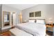 Bright bedroom featuring a view into an adjacent bathroom and soft, neutral colored walls at 218 Archdale Dr, Durham, NC 27707