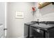 A laundry room featuring a modern washer and dryer set against a light gray wall at 218 Archdale Dr, Durham, NC 27707