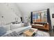 Bright living room featuring a vaulted ceiling, large windows, and modern decor at 218 Archdale Dr, Durham, NC 27707