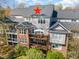 Aerial view of a multi story condo building with decks and ample sunlight at 222 Lions Gate Dr, Cary, NC 27518