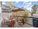 Relax on this cozy wooden deck with comfortable seating and a stylish umbrella, perfect for outdoor enjoyment at 222 Lions Gate Dr, Cary, NC 27518