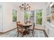 Charming breakfast nook with ample natural light and stylish chandelier at 222 Lions Gate Dr, Cary, NC 27518
