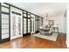 Elegant dining room featuring hardwood floors, chandelier, and access to an outdoor balcony at 222 Lions Gate Dr, Cary, NC 27518
