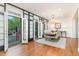 Elegant dining room featuring hardwood floors, chandelier, and access to an outdoor balcony at 222 Lions Gate Dr, Cary, NC 27518