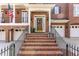 Inviting brick front entrance with steps leading to a decorative wooden front door at 222 Lions Gate Dr, Cary, NC 27518