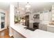 Gourmet kitchen with stainless steel appliances, quartz countertops, and stylish pendant lighting at 222 Lions Gate Dr, Cary, NC 27518