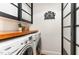Efficient laundry room with modern washer and dryer, butcher block countertop, and ample storage at 222 Lions Gate Dr, Cary, NC 27518