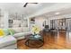 Open-concept living room featuring hardwood floors and seamless transition to the kitchen and dining area at 222 Lions Gate Dr, Cary, NC 27518