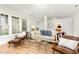 Bright living room with hardwood floors, neutral walls, plentiful windows, and comfortable seating at 222 Lions Gate Dr, Cary, NC 27518