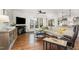 Bright living room with fireplace, large windows, hardwood floors, and comfortable seating at 222 Lions Gate Dr, Cary, NC 27518