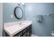Bathroom featuring a white sink and dark wood cabinets at 227 Chimney Rise Dr, Cary, NC 27511