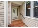 Inviting front entrance with brick steps and decorative glass storm door at 227 Chimney Rise Dr, Cary, NC 27511