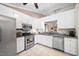 Well-lit kitchen features stainless steel appliances, granite countertops, and white cabinets at 227 Chimney Rise Dr, Cary, NC 27511