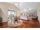 Spacious living room with vaulted ceiling, hardwood floors, and natural light at 227 Chimney Rise Dr, Cary, NC 27511