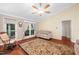 Bright living room with vaulted ceiling, hardwood floors, ceiling fan and access to outdoor space at 227 Chimney Rise Dr, Cary, NC 27511