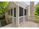 Charming screened porch featuring white wood and a stairway offering outdoor living space at 227 Chimney Rise Dr, Cary, NC 27511