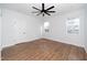 Bright bedroom with a ceiling fan, large windows, and neutral decor, creating a serene and inviting atmosphere at 2517 Newbold St, Raleigh, NC 27603