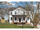 Charming two-story home with a welcoming front porch and beautifully landscaped front yard at 2517 Newbold St, Raleigh, NC 27603