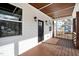Inviting front porch with a dark wood ceiling and porch, offering a welcoming entrance to the home at 2517 Newbold St, Raleigh, NC 27603