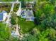 Aerial view of the home featuring the manicured lawn, mature trees and overall landscaping at 255 Williamston Ridge Dr, Youngsville, NC 27596