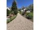Picturesque gravel pathway leading to a home with a lush backyard, and a screened in porch at 255 Williamston Ridge Dr, Youngsville, NC 27596
