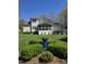 Lush backyard with a well-maintained lawn and lovely landscaping, creating a peaceful outdoor retreat at 255 Williamston Ridge Dr, Youngsville, NC 27596