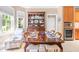 Charming dining room with a wooden table, elegant china cabinet, and natural light from nearby window at 255 Williamston Ridge Dr, Youngsville, NC 27596